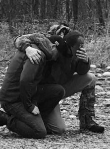 Participants Engaging in Equine-Assisted Support Two participants caring for and working alongside a horse during an equine-assisted therapeutic activity.
