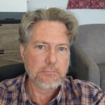 Portrait of Dr. David Hamilton, psychiatrist specializing in trauma therapy, PTSD treatment, and innovative mental health care approaches.