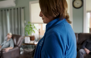 Dr. Manuela Joannou facilitating a trauma support group session in a calm clinical setting focused on PTSD recovery and therapeutic care programs.