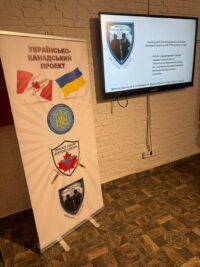 Project Trauma Support slide displayed beside a Ukrainian-Canadian Project banner in Lviv.